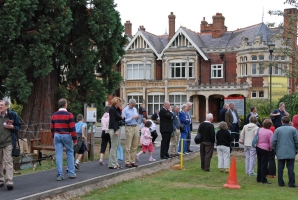 Various activities and re-enactments on the grass in front of the mansion